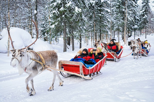 It doesn’t feel much more like Christmas than a reindeer-pulled sled ride in Finland